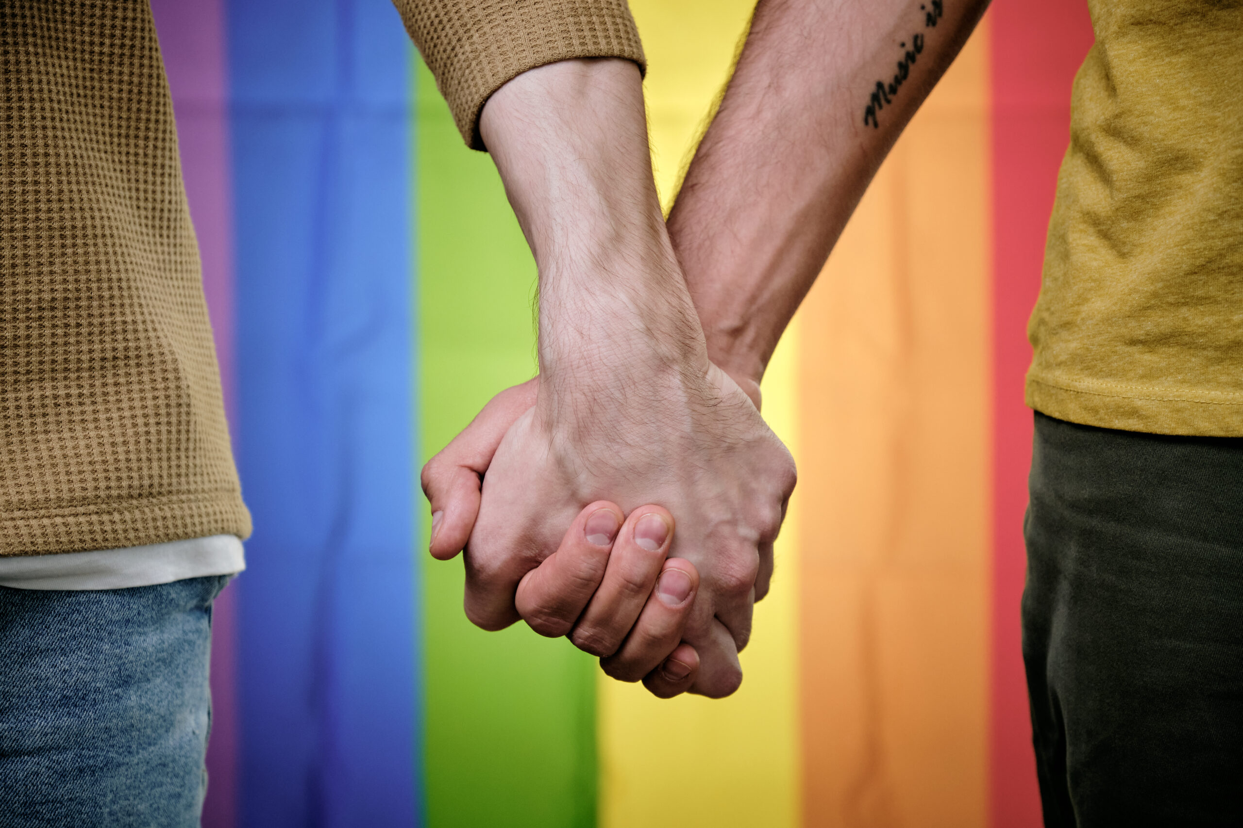 Coming Out and Finding Love - gay couple holding hands