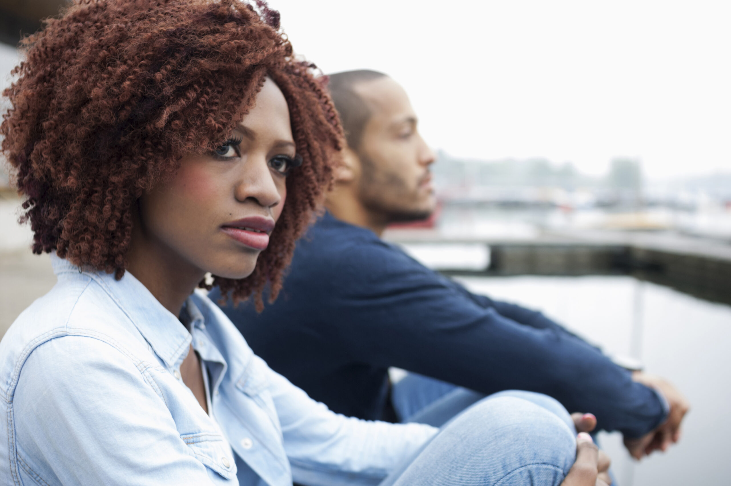 Understanding the Difference Between Separated and Divorced - couple sitting together unhappy.