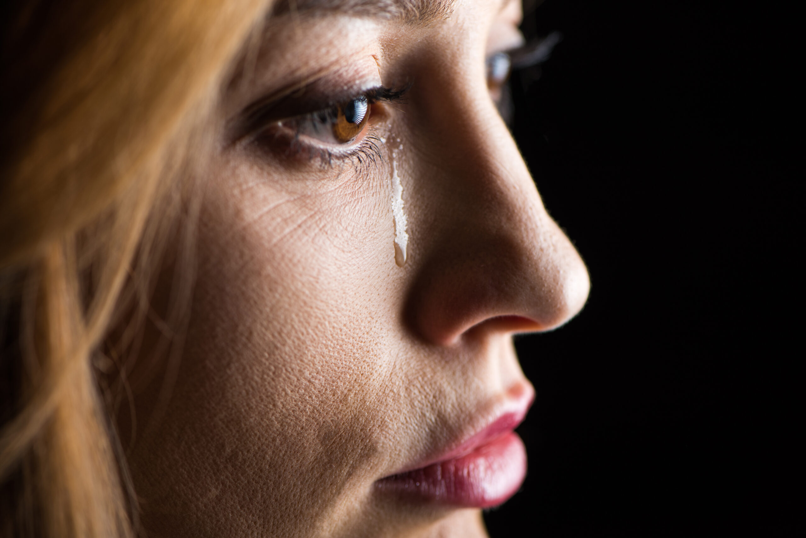 Widowed or divorced seniors date with hope - close up of crying woman