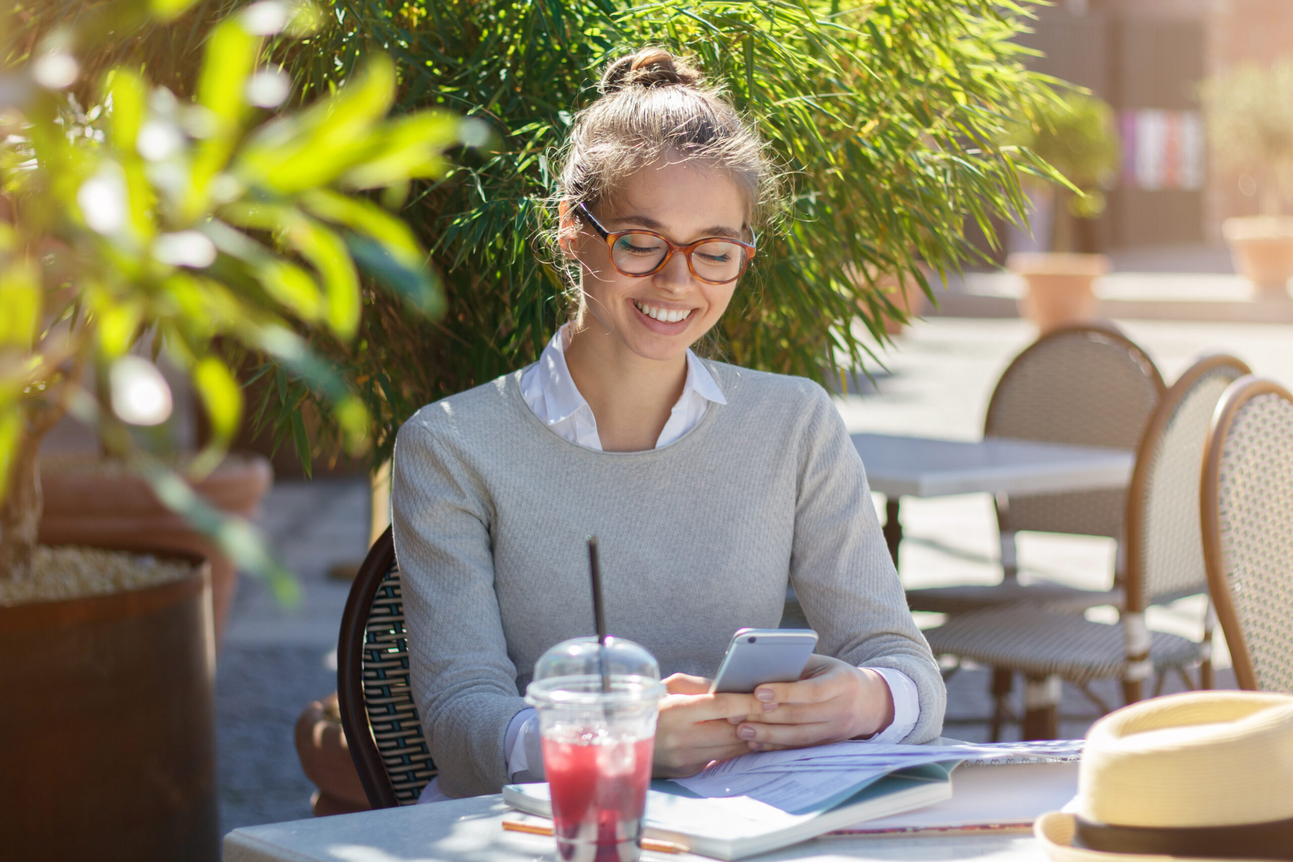 Young smiling attractive woman texting her boyfriend